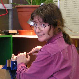 Teresinha carving in workshop